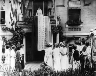 Unknown photographer: Alice Paul Unfurls the Ratification Flag at National Woman’s Party Headquarters in Celebration When Tennessee Became the 36th State to Ratify the Federal Suffrage Amendment