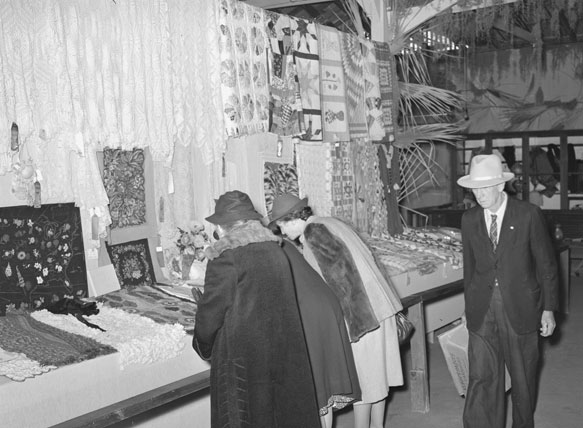 Russell Lee: Women looking at quilting and crocheting exhibit at Gonzalez County Fair