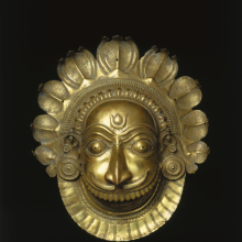 <p>Mask of a Fierce <em>Bhuta </em>Deity. Western India (Karnataka), circa 18th century. Brass, 18 3/4 × 16 7/16 × 7 1/2 in. (47.6 × 41.8 × 19.1 cm). Brooklyn Museum; Purchase gift of Dr. Bertram H. Schaffner, 1996.24. (Photo: Brooklyn Museum)</p>