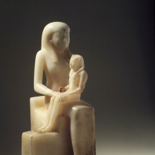 <p><em>Statuette of Queen Ankhnes-meryre II and Her Son, Pepy II</em>. Egypt, probably from Upper Egypt. Old Kingdom, Dynasty 6, reign of Pepy II, circa 2288–2224/2194 <small>B.C.E.</small> Egyptian alabaster, 15<sup>7</sup>⁄<sub>16</sub> x 9<sup>13</sup>⁄<sub>16</sub> in. (39.2 × 24.9 cm). Brooklyn Museum, Charles Edwin Wilbour Fund, 39.119</p>