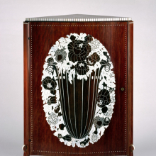 <p>Émile-Jacques Ruhlmann (French, 1879–1933). Corner Cabinet, circa 1923. Kingwood (amaranth) veneer on mahogany, ivory inlay, 49<sup>7</sup>/<sub>8</sub> × 31<sup>3</sup>/<sub>4</sub> × 23<sup>1</sup>/<sub>2</sub> in. (126.7 × 80.6 × 59.7 cm). Purchased with funds given by Joseph F. McCrindle, Mrs. Richard M. Palmer, Charles C. Paterson, Raymond Worgelt, and an anonymous donor, 71.150.1. (Photo: Brooklyn Museum)</p>