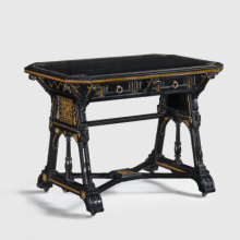 <p>Kimbel and Cabus (New York, 1863–82). Table, circa 1875. Ebonized wood, gilding, paper, metal. 30<sup>7</sup>/<sub>8</sub> × 42 × 27 in. (78.4 × 106.7 × 68.6 cm). Collection of Deedee and Barrie Wigmore. (Photo: Gavin Ashworth)</p>