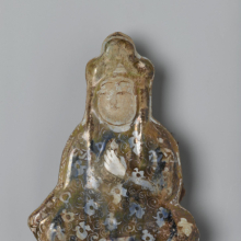 <p>Tile in the Shape of a Seated Figure, Iran (probably Kashan), early 13th century. Ceramic; fritware, molded, underglaze painted, overglaze lustered, 5 1/2 × 4 in. (14 × 10.2 cm). Brooklyn Museum, Gift of the Ernest Erickson Foundation, Inc., 86.227.69. (Photo: Brooklyn Museum)</p>