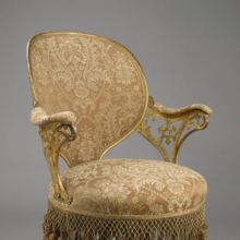 <p>Thomas E. Warren (American, 1808–18?). <i>“Centripetal Spring” Chair</i>, patented September 25, 1849. Manufactured by the American Chair Company (active 1829–1858). Cast iron, sheet metal, wood, modern upholstery, original fringe, 34<sup>1</sup>⁄<sub>4</sub> x 23<sup>1</sup>⁄<sub>2</sub> x 28<sup>1</sup>⁄<sub>4</sub> in. (87 × 59.7 × 71.8 cm). Brooklyn Museum, Designated Purchase Fund, 2009.27</p>