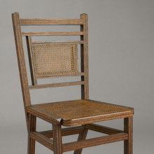 <p>George Jacob Hunzinger (American, born Germany, 1835–1898). <i>Side Chair</i>, Patented March 13, 1883. Wood, cane, straw braid, 35<sup>3</sup>⁄<sub>8</sub> x 17<sup>1</sup>⁄<sub>2</sub> x 20<sup>3</sup>⁄<sub>8</sub> in. (89.9 × 44.5 × 51.8 cm). Brooklyn Museum, Designated Purchase Fund, 2011.13</p>