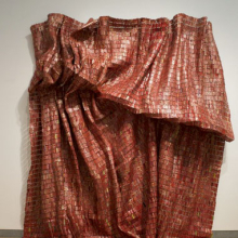<p>El Anatsui (Ghanaian, b. 1944). <i>Red Block</i>, 2010. Aluminum and copper wire, Two pieces, each 200<sup>3</sup>⁄<sub>4</sub> x 131<sup>1</sup>⁄<sub>2</sub> in. (509.9 × 334 cm). Courtesy of the Broad Art Foundation. Brooklyn Museum photograph</p>