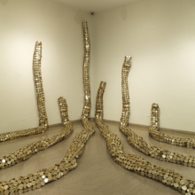 <p>El Anatsui (Ghanaian, b. 1944). <i>Drainpipe</i>, 2010. Tin and copper wire, installation at the Brooklyn Museum, dimensions variable. Courtesy of the artist and Jack Shainman Gallery, New York. Brooklyn Museum photograph</p>