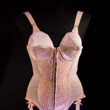 <p>Jean Paul Gaultier (French, b. 1952). Corset-style body suit with garters, 1990, Duchess satin. Worn by Madonna during the “Metropolis” (“Express Yourself”) sequence of the Blond Ambition World Tour (1990). Collection of Madonna, New York. (Photo: The Montreal Museum of Fine Arts, Christine Guest)</p>