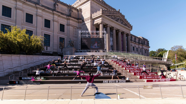 <p>Participants practice socially distant yoga on the Brooklyn Museum steps</p>
