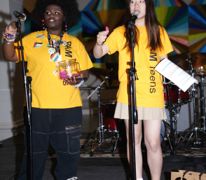 Teens performing at microphones