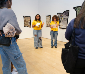 Teens reading in a gallery