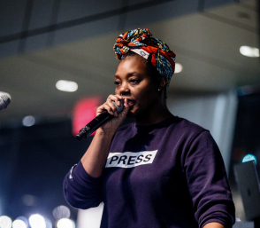 A person speaking into a microphone