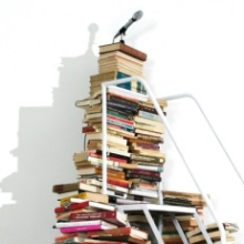 <p>Satch Hoyt (b. United Kingdom 1957; works in United States). <em>Say It Loud!</em>, 2004. Five hundred books, white metal staircase, and microphone with four speakers, wall text; dimensions variable. Courtesy of the artist</p>