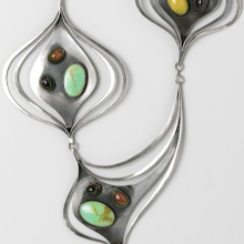 <p>Art Smith (American, 1917–1982). <i>“Ellington” Necklace</i>, circa 1962. Silver, turquoise, amethyst, prase, rhodonite, 16<sup>7</sup>⁄<sub>8</sub> x 9<sup>7</sup>⁄<sub>8</sub> x <sup>3</sup>⁄<sub>4</sub> in. (42.9 × 25.1 × 1.9 cm). Brooklyn Museum, Gift of Charles L. Russell, 2007.61.4</p>