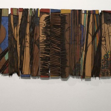 <p>El Anatsui (Ghanaian, b. 1944). <i>Conspirators</i>, 1997. Wooden relief with paint, 24 × 55<sup>3</sup>⁄<sub>4</sub> x <sup>7</sup>⁄<sub>8</sub> in. (61 × 141.6 × 2.2 cm). Courtesy of the artist and Jack Shainman Gallery, New York. Brooklyn Museum photograph</p>