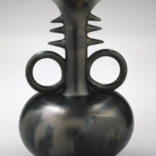 <p>Left: Magdalene Anyango N. Odundo (British, born 1950, Kenya). <em>Vessel</em>, 1990, Farnham, Surrey, United Kingdom. Ceramic, slip, 16 × 10 × 10 in. (40.6 × 25.4 × 25.4 cm). Brooklyn Museum, Purchased with funds given by Dr. and Mrs. Sidney Clyman and the Frank L. Babbott Fund, 1991.26; Right: Unidentified Nok culture artist, circa 550–50 <small>B.C.E.</small> <em>Male Head</em>, Kaduna, Plateau or Nassarawa state, Nigeria. Terracotta, 12 × 7<sup>1</sup>⁄<sub>2</sub> x 9<sup>1</sup>⁄<sub>2</sub> in. (30.5 × 19.1 × 24.1 cm). Brooklyn Museum, Gift of Lisa and Bernard Selz, exhibited through the generosity of the National Commission for Museums and Monuments of the Federal Republic of Nigeria, TL2005.62. (Photos: Brooklyn Museum)</p>