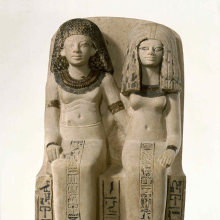 <p><em>Pair Statue of Nebsen and Nebet-ta</em>. Egypt, possibly from Dahamsha. New Kingdom, Dynasty 18, early in the reign of Amunhotep III, circa 1400–1352 <small>B.C.E.</small> Limestone, painted, 15<sup>3</sup>⁄<sub>4</sub> x 8<sup>9</sup>⁄<sub>16</sub> x 9<sup>1</sup>⁄<sub>4</sub> in. (40 × 21.8 × 23.5 cm). Brooklyn Museum, Charles Edwin Wilbour Fund, 40.523</p>