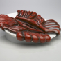 <p>Judy Chicago (American, b. 1939). <em>The Dinner Party</em> (Margaret Sanger plate), 1974–79. Porcelain (possibly stoneware), overglaze enamel (China paint), paint, 14 3/8 × 14 1/2 × 1 3/8 in. (36.5 × 36.8 × 3.5 cm). Brooklyn Museum, Gift of the Elizabeth A. Sackler Foundation, 2002.10. © Judy Chicago</p>