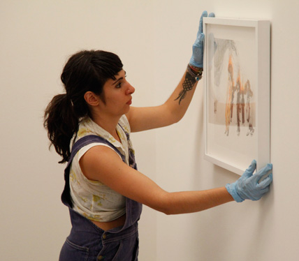 Kymia Nawabi, winner of Work of Art: The Next Great Artist, season two, installing a work in the episode 