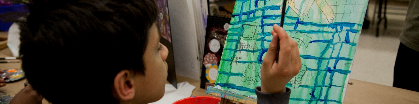 A child painting in an art class