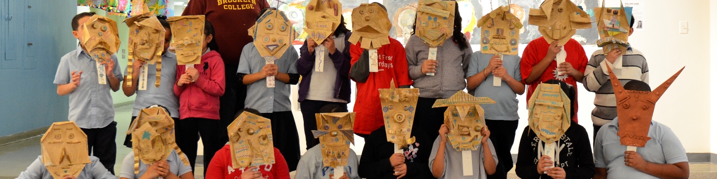 Kids wearing masks they've made