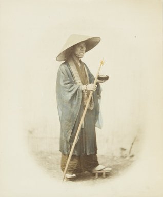 <em>"Mendicant priest with bowl and staff, Shin-gon-fodo sect"</em>. Bw photographic print, hand tinted. Brooklyn Museum. (Photo: Brooklyn Museum, DS821_P56_no17_PS4.jpg