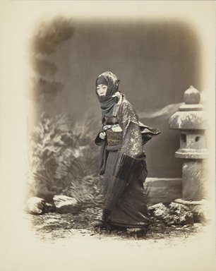 <em>"Woman with a folded umbrella in winter landscape"</em>. Bw photographic print, hand tinted. Brooklyn Museum. (Photo: Brooklyn Museum, DS821_P56_no22_PS4.jpg