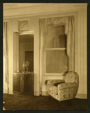 <em>"Weil-Worgelt apartment; upholstered chair in front of Art Deco patterned window."</em>. Bw photographic print, sepia toned. Brooklyn Museum, CHART_2011. (NK2004_W42_Weil_Worgelt_apartment_page03.jpg