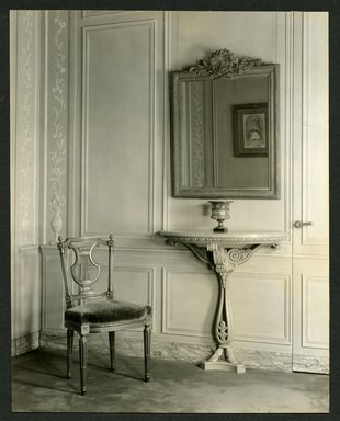<em>"Weil-Worgelt apartment; velvet upholstered chair, mirror, and console table in French eighteenth-century revival style."</em>. Bw photographic print, 5 x 7 in (13 x 16 cm). Brooklyn Museum, CHART_2011. (NK2004_W42_Weil_Worgelt_apartment_page04.jpg