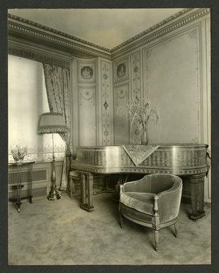 <em>"Weil-Worgelt apartment; piano and upholstered chair in French eighteenth-century revival style."</em>. Bw photographic print, 5 x 7 in (13 x 16 cm). Brooklyn Museum, CHART_2011. (NK2004_W42_Weil_Worgelt_apartment_page18.jpg