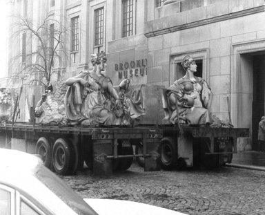 <em>"Brooklyn Museum: exterior. View of the installation of Daniel Chester French's Brooklyn and Manhattan statues at the front entrance of the museum, showing statues on flatbeds, 1964."</em>, 1964. Bw copy negative 4x5in, 4 x 5in (10.2 x 12.7 cm). Brooklyn Museum, Museum building. (Photo: Brooklyn Museum, S06_BEEi048.jpg