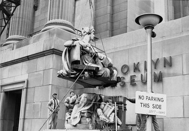 <em>"Brooklyn Museum: exterior. View of the installation of Daniel Chester French's Brooklyn and Manhattan statues at the front entrance of the museum, showing the hoisting of Brooklyn statue, 1964."</em>, 1964. Bw copy negative 4x5in, 4 x 5in (10.2 x 12.7 cm). Brooklyn Museum, Museum building. (Photo: Brooklyn Museum, S06_BEEi054.jpg