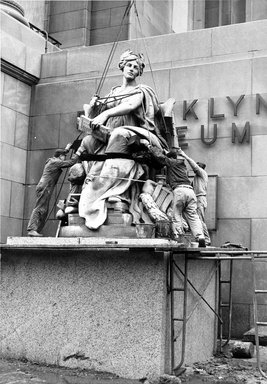 <em>"Brooklyn Museum: exterior. View of the installation of Daniel Chester French's Brooklyn and Manhattan statues at the front entrance of the museum, showing Brooklyn statue on the pedestal, 1964."</em>, 1964. Bw copy negative 4x5in, 4 x 5in (10.2 x 12.7 cm). Brooklyn Museum, Museum building. (Photo: Brooklyn Museum, S06_BEEi056.jpg