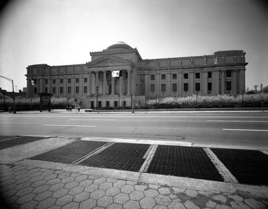 <em>"Brooklyn Museum: exterior. View of the Eastern Parkway façade from the north, showing cherry blossoms and Eastern Parkway in the foreground, 05/1983."</em>, 1983. Bw negative 8x10in, 8 x 10in (20.3 x 25.4 cm). Brooklyn Museum, Museum building. (Photo: Brooklyn Museum, S06_BEEi105.jpg