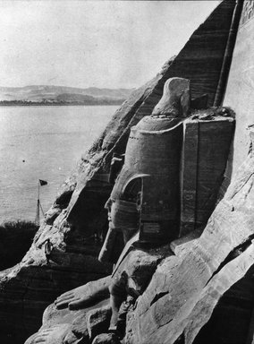 <em>"Views, Objects: Egypt. Abu Simbel. View 12: The Great Rock Temple at Abu Simbel. First Colossus of King Ramses II Dyn. XIX 1250 B.C."</em>. Lantern slide 3.25x4in, 3.25 x 4 in. Brooklyn Museum, lantern slides. (S10_08_Egypt_AbuSimbel12.jpg