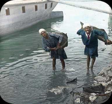 <em>"Views, Objects: Egypt. General Views; People. View 010: Egypt - Water Carriers - Men, Cairo."</em>. Lantern slide 3.25x4in, 3.25 x 4 in. Brooklyn Museum, lantern slides. (S10_08_Egypt_GeneralViews_People010.jpg