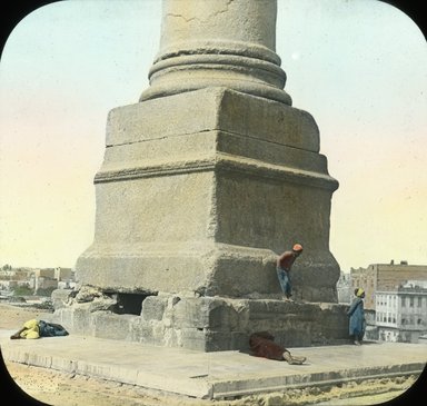 <em>"Views, Objects: Egypt. General Views; People. View 052: Egypt - Base of Pompey's Pillar, Alexandria."</em>. Lantern slide 3.25x4in, 3.25 x 4 in. Brooklyn Museum, lantern slides. (Photo: T. H. McAllister, New York, S10_08_Egypt_GeneralViews_People052.jpg