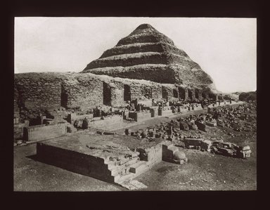 <em>"Views, Objects: Egypt. Sakkara. View 09: Egyptian - Old Kingdom. Step Pyramid and enclosure, Sakkara, 3rd Dyn."</em>. Lantern slide 3.25x4in, 3.25 x 4 in. Brooklyn Museum, lantern slides. (S10_08_Egypt_Sakkara09_SL1.jpg