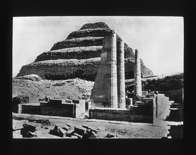 <em>"Views, Objects: Egypt. Sakkara. View 15: Egyptian - Old Kingdom.  Step Pyramid and limestone columns, Sakkara, 3rd Dyn."</em>. Lantern slide 3.25x4in, 3.25 x 4 in. Brooklyn Museum, lantern slides. (S10_08_Egypt_Sakkara15_SL1.jpg