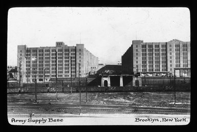 <em>"Views: Brooklyn, Long Island, Staten Island. Brooklyn scenes; buildings. View 014: Army supply base. Cass Gilbert, architect."</em>. Lantern slide 3.25x4in, 3.25 x 4 in. Brooklyn Museum, CHART_2011. (S10_11_Brooklyn_LI_SI_Brooklyn_Scenes_Buildings014.jpg