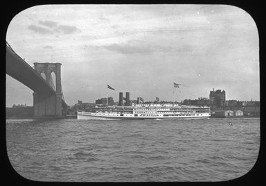 <em>"Views: U.S., Brooklyn. Brooklyn Bridge. View 001: East River and Brooklyn Bridge."</em>. Lantern slide 3.25x4in, 3.25 x 4 in. Brooklyn Museum, CHART_2011. (Photo: W. A. Boqen, S10_21_US_Brooklyn_Brooklyn_Bridge001.jpg