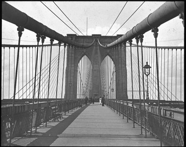 <em>"Views: U.S., Brooklyn. Brooklyn Bridge. View 002: Brooklyn Tower and tracery of 'Spider Web'."</em>. Lantern slide 3.25x4in, 3.25 x 4 in. Brooklyn Museum, CHART_2011. (S10_21_US_Brooklyn_Brooklyn_Bridge002.jpg