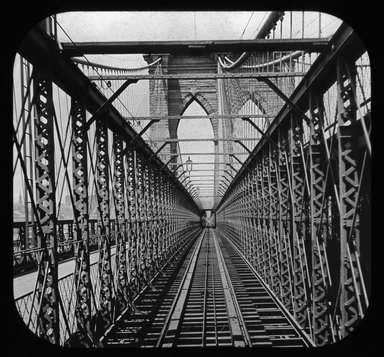 <em>"Views: U.S., Brooklyn. Brooklyn Bridge. View 011: Brooklyn Bridge from car platform."</em>. Lantern slide 3.25x4in, 3.25 x 4 in. Brooklyn Museum, CHART_2011. (Photo: S. W. Lewis, S10_21_US_Brooklyn_Brooklyn_Bridge011.jpg