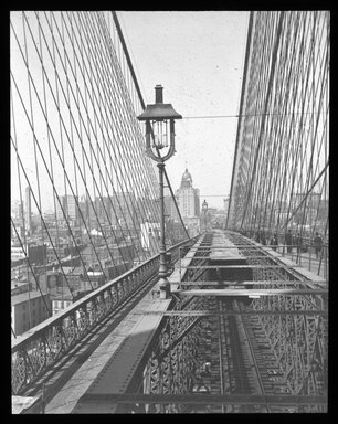 <em>"Views: U.S., Brooklyn. Brooklyn Bridge. View 015: Looking to New York from Brooklyn Tower."</em>. Lantern slide 3.25x4in, 3.25 x 4 in. Brooklyn Museum, CHART_2011. (S10_21_US_Brooklyn_Brooklyn_Bridge015.jpg