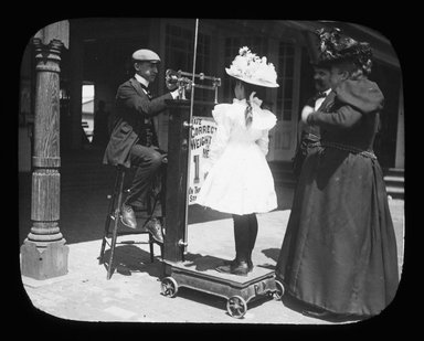 <em>"Views: U.S., Brooklyn. Brooklyn, Coney Island. View 009: Coney Island (girl getting weighed on boardwalk) 1900."</em>, 1900. Lantern slide 3.25x4in, 3.25 x 4 in. Brooklyn Museum, CHART_2011. (Photo: P. G. Farquharson, S10_21_US_Brooklyn_Brooklyn_Coney_Island009.jpg