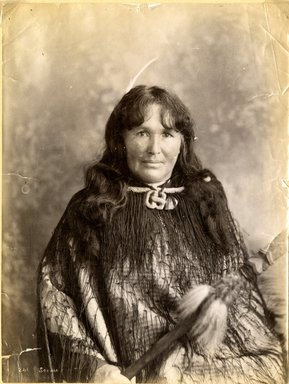 <em>"Portrait of Maori woman earing hei-tiki necklace and string cloak."</em>, 1883. Bw photographic print, 5 x 7 in (13 x 16 cm). Brooklyn Museum. (Photo: Brooklyn Museum, TR680_N42_Maori_TL1986.450.37_SL4.jpg