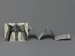 <em>"Brooklyn Bridge : 100 years"</em>. Printed material. Brooklyn Museum. (N200_H365_B79_Henderikse_Brooklyn_Bridge_100_structure_PS1.jpg