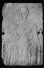 Carved Tomb Slab.  Relief, half-length portrait of beardless manwith eyes closed, hands crossed on breast.