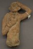 Figure with One Hand on Head