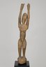 Female Figure Standing with Arms Raised